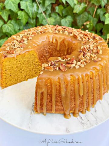 Sliced Pumpkin Bundt Cake on a cake pedestal.