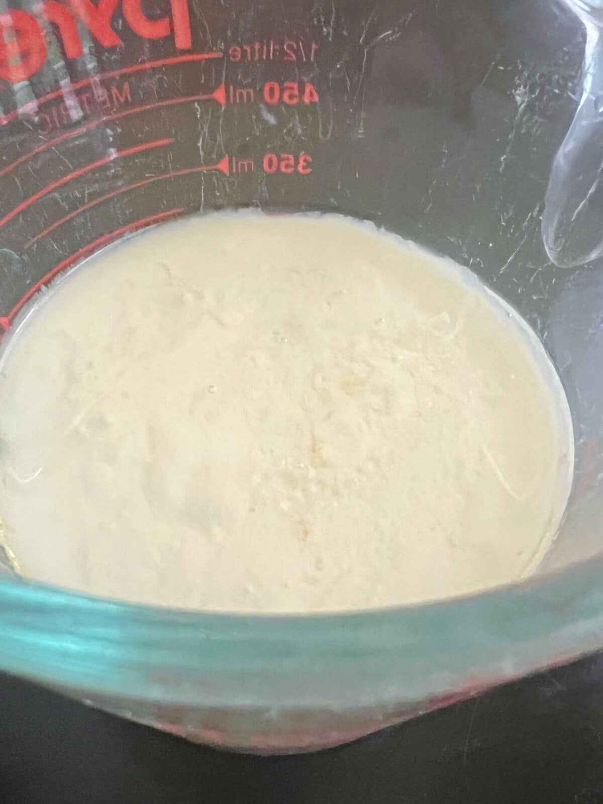 wet ingredients for cake in measuring cup.