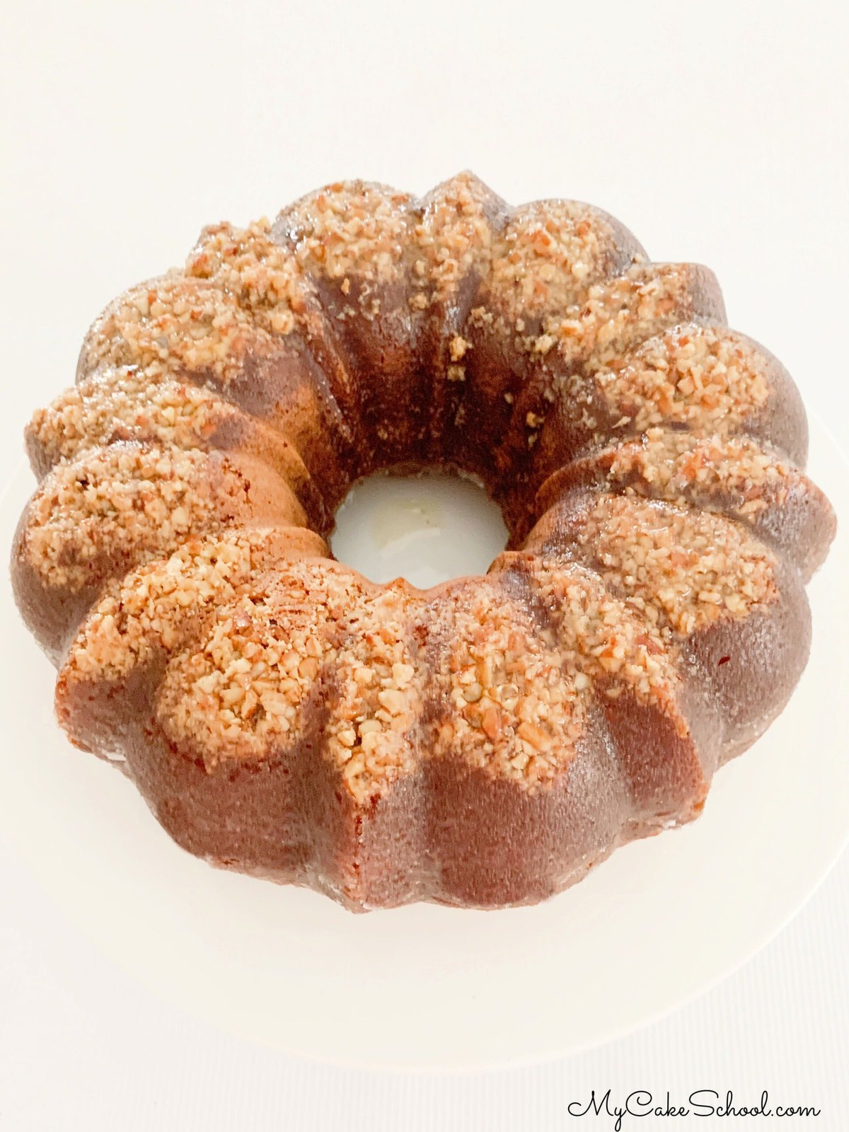 Eggnog Rum Bundt Cake on a cake pedestal.