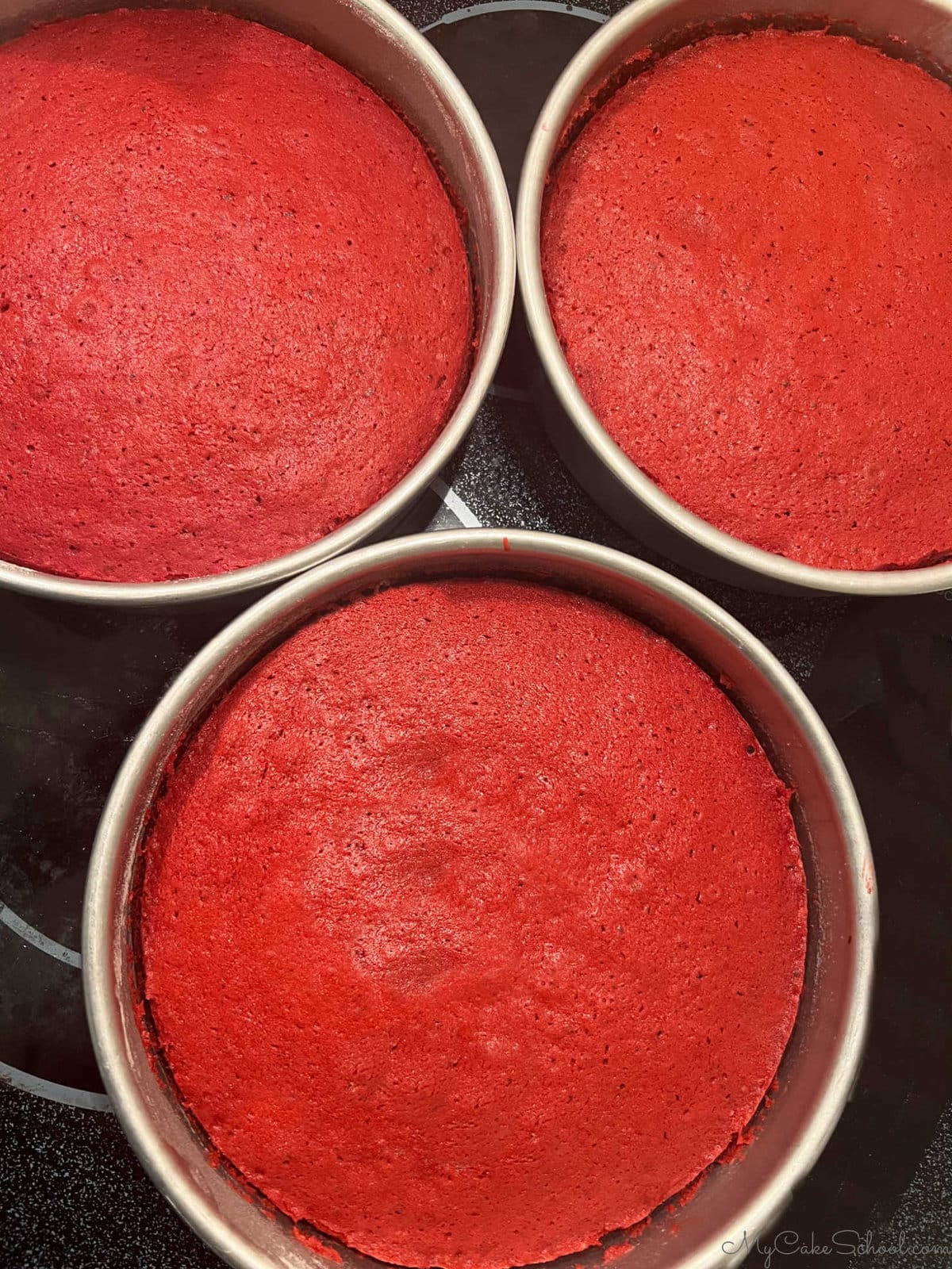 Red Velvet Cake Layers in pans, freshly baked.