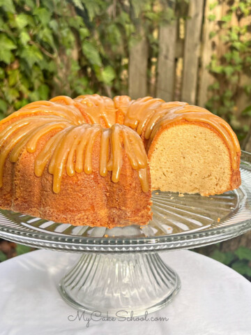 Sliced Caramel Eggnog Pound Cake on a cake pedestal.