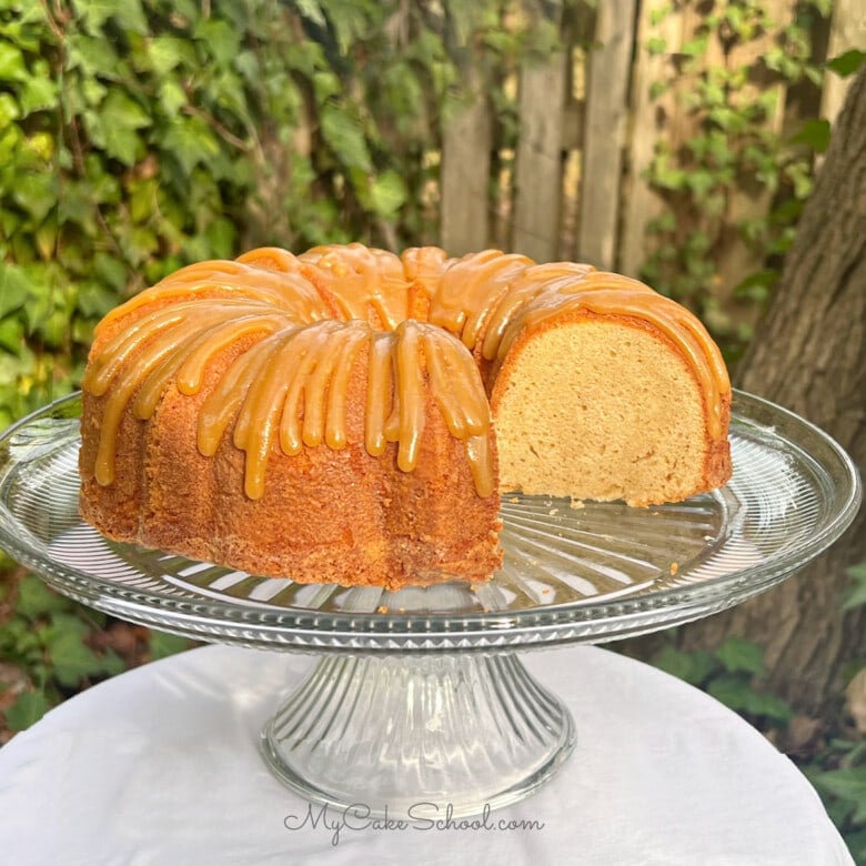 Sliced Caramel Eggnog Pound Cake on a cake pedestal.