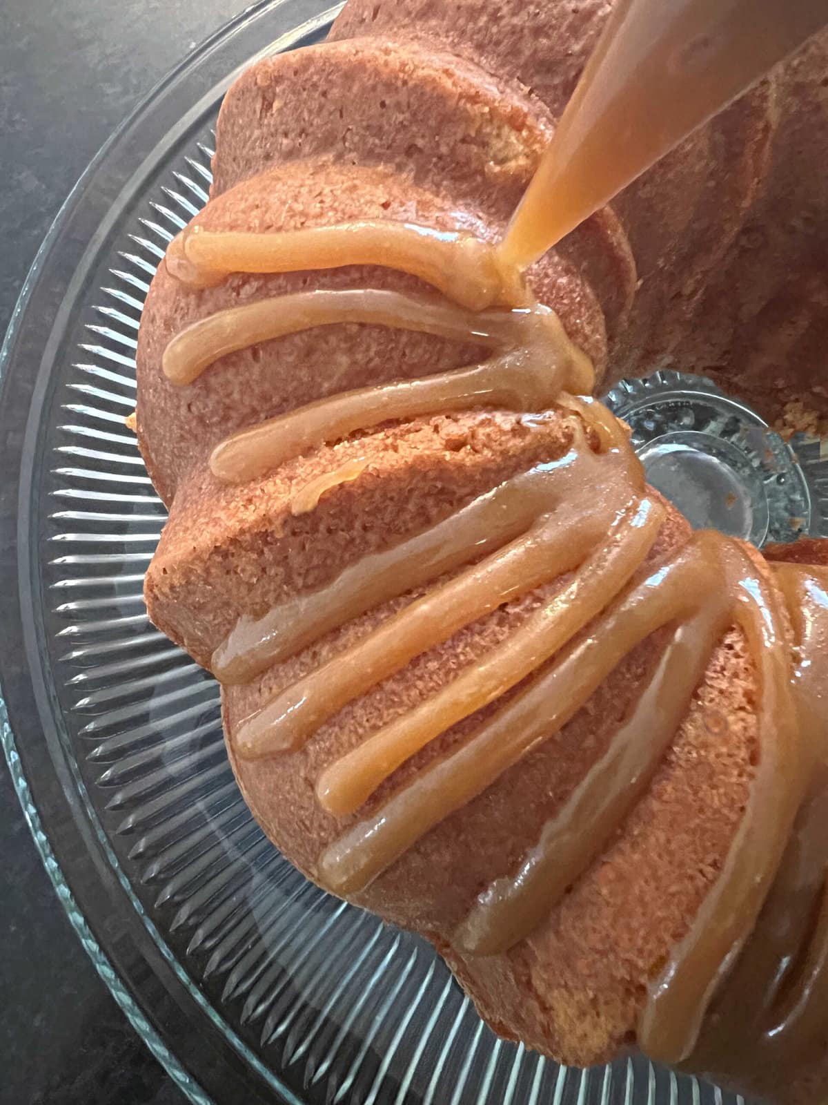 Applying Caramel Glaze to Caramel Eggnog Pound Cake.