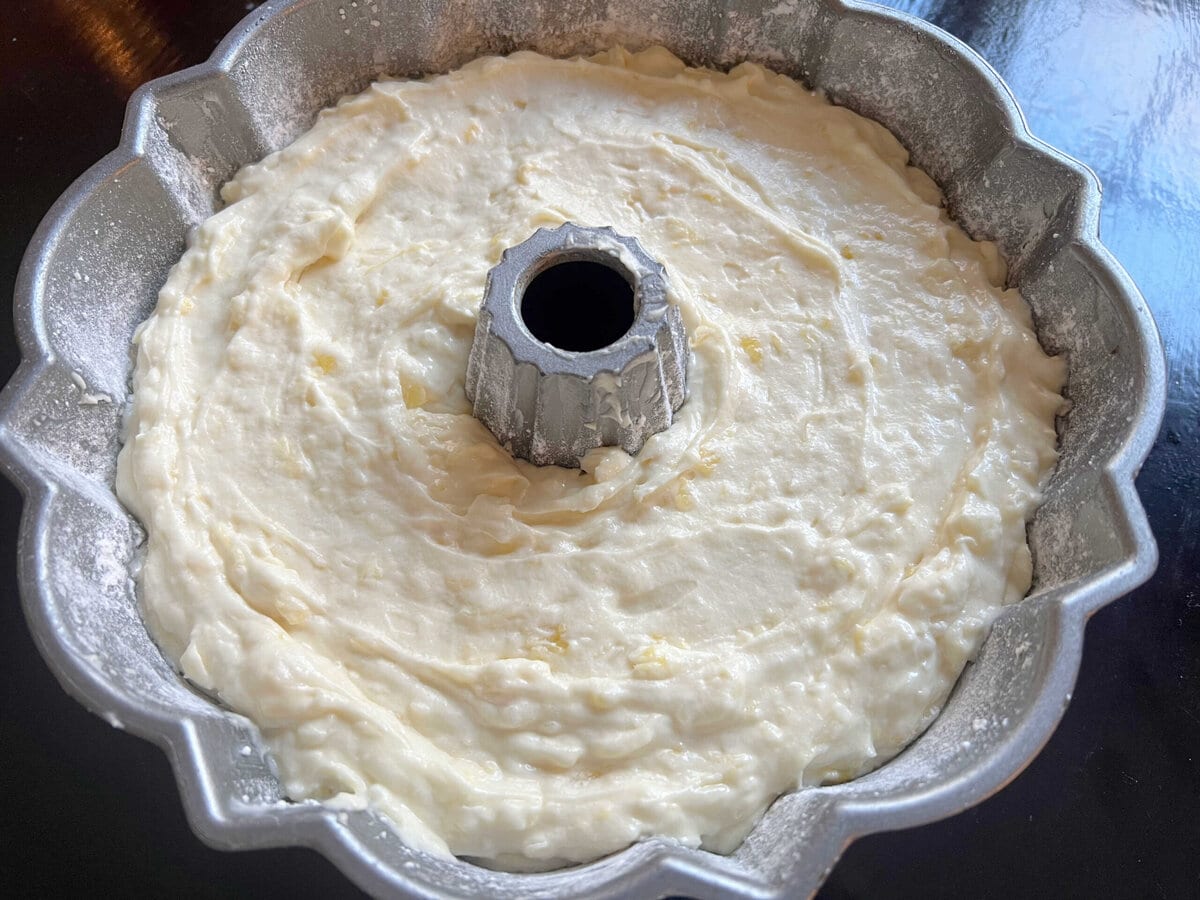 Pina colada pound cake batter in bundt pan.