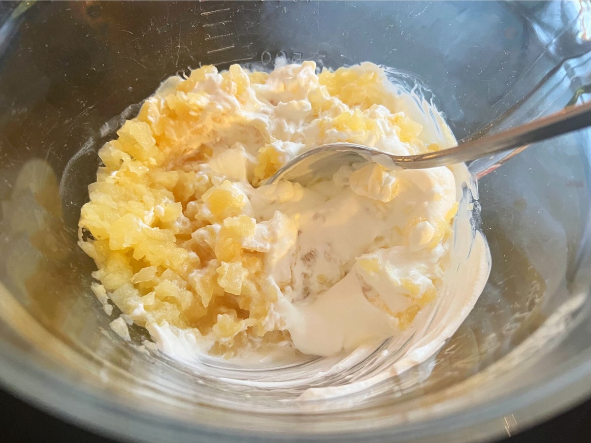 Mixture of crushed pineapple and sour cream.