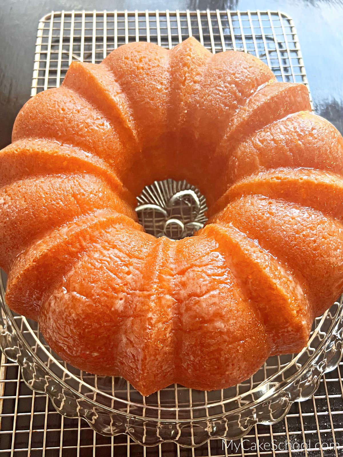 Freshly Baked Limoncello Bundt Cake on a cake pedestal.