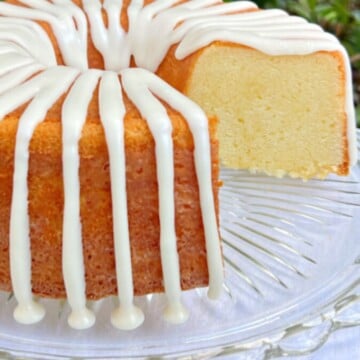 Five Flavor Pound Cake on a cake pedestal, sliced.