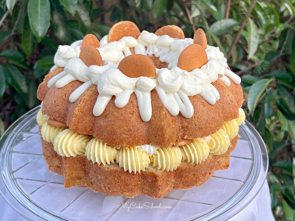 Banana Pudding Bundt Cake on a pedestal.