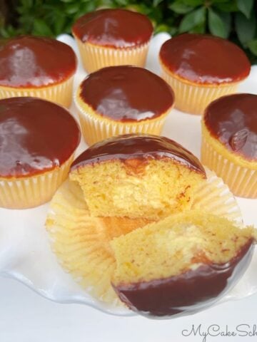 Boston Cream Cupcakes on a cake pedestal.