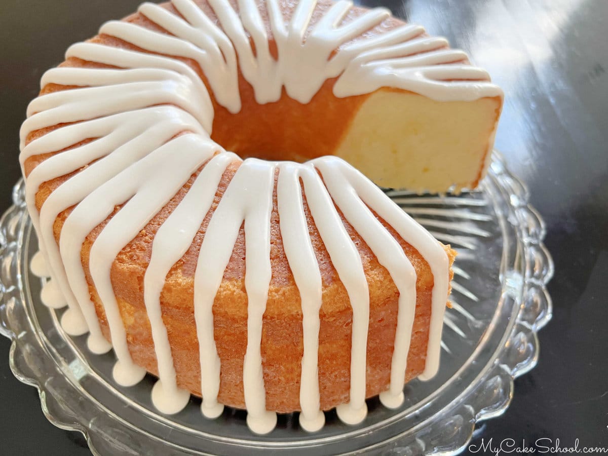 Five Flavor Pound Cake, sliced, on a cake pedestal.