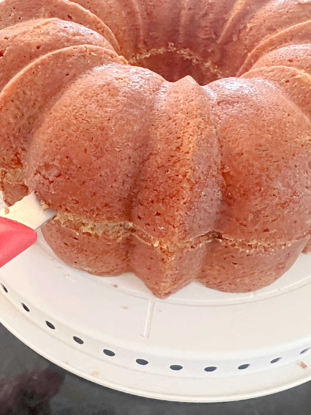 Splitting the bundt cake in half.