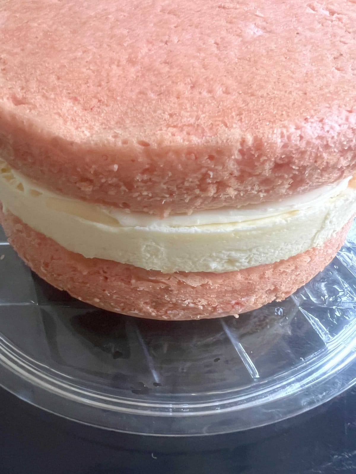 Unfrosted Cheesecake Cake Layers, filled and stacked.