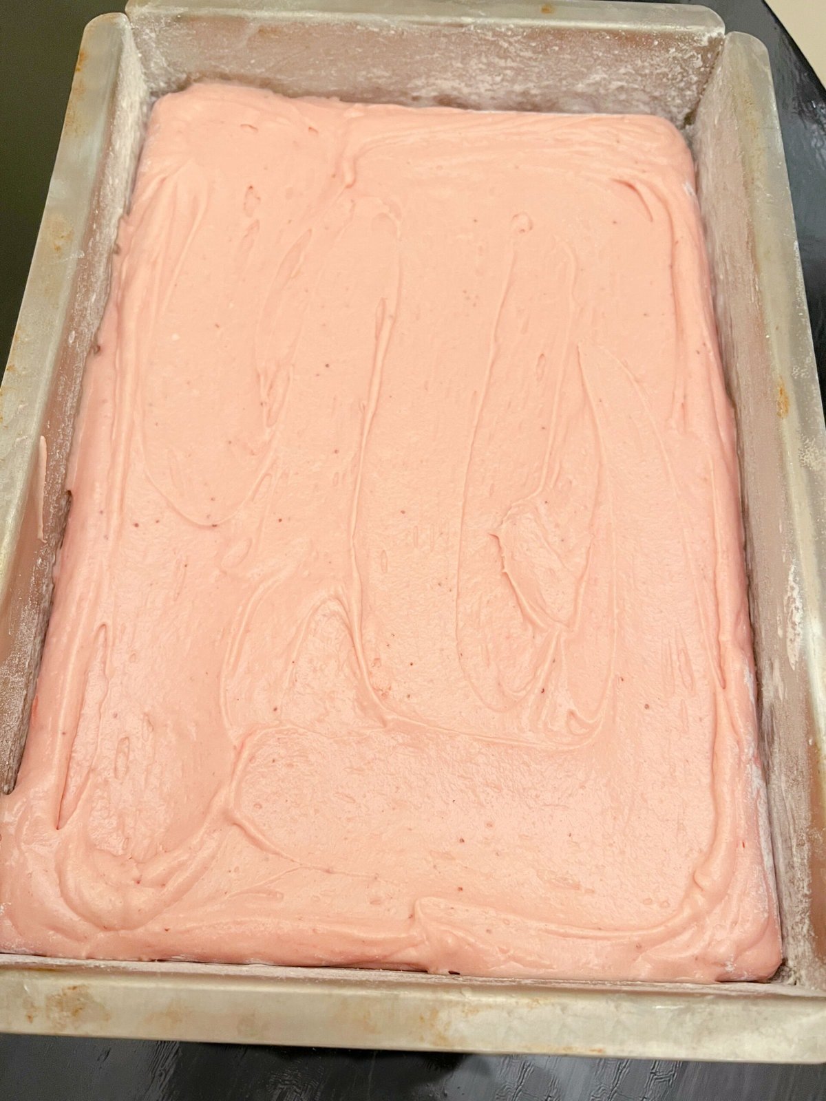 Strawberry Cake Batter in sheet cake pan.