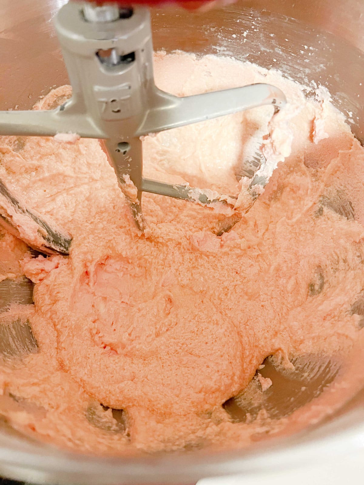 Strawberry Sheet Cake batter in mixing bowl after adding eggs to sugar and butter.