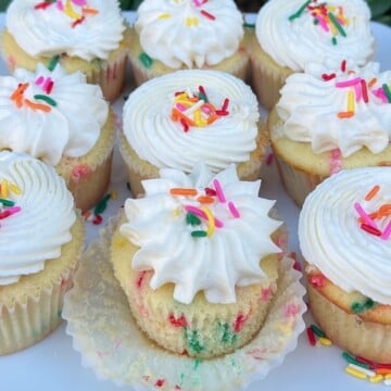 Funfetti Cupcakes on a platter, frosted with vanilla buttercream.