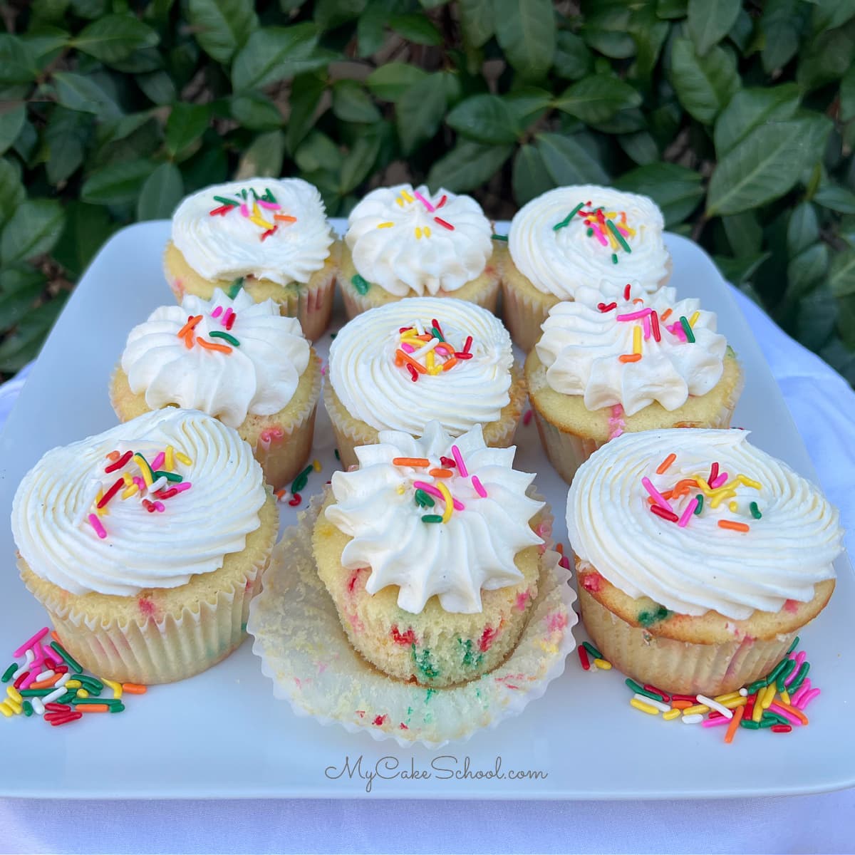 Funfetti Cupcakes on a cake platter.