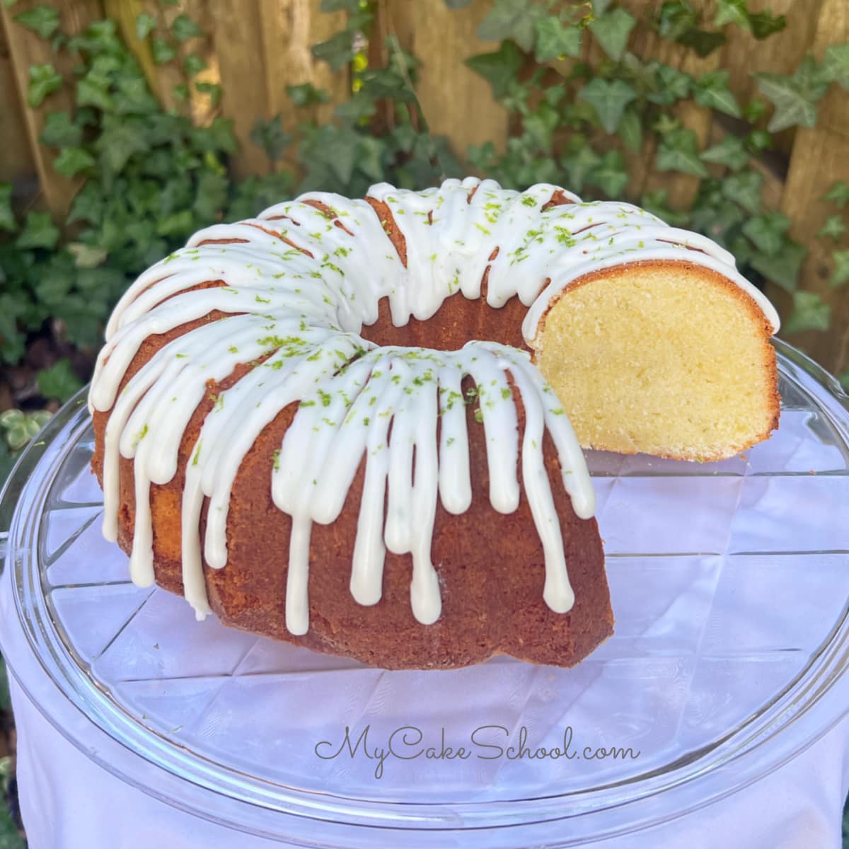 Sliced Key Lime Pound Cake on a cake pedestal.