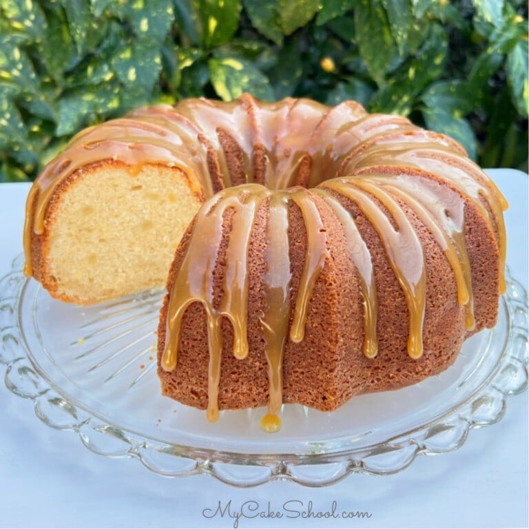 Sliced Pear Cake on a cake pedestal.