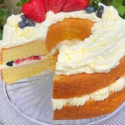 Lemon Berry Bundt Cake, sliced, on a cake pedestal.