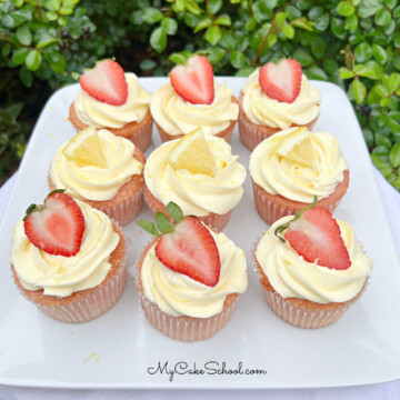 Strawberry Lemonade Cupcakes on a cake platter.