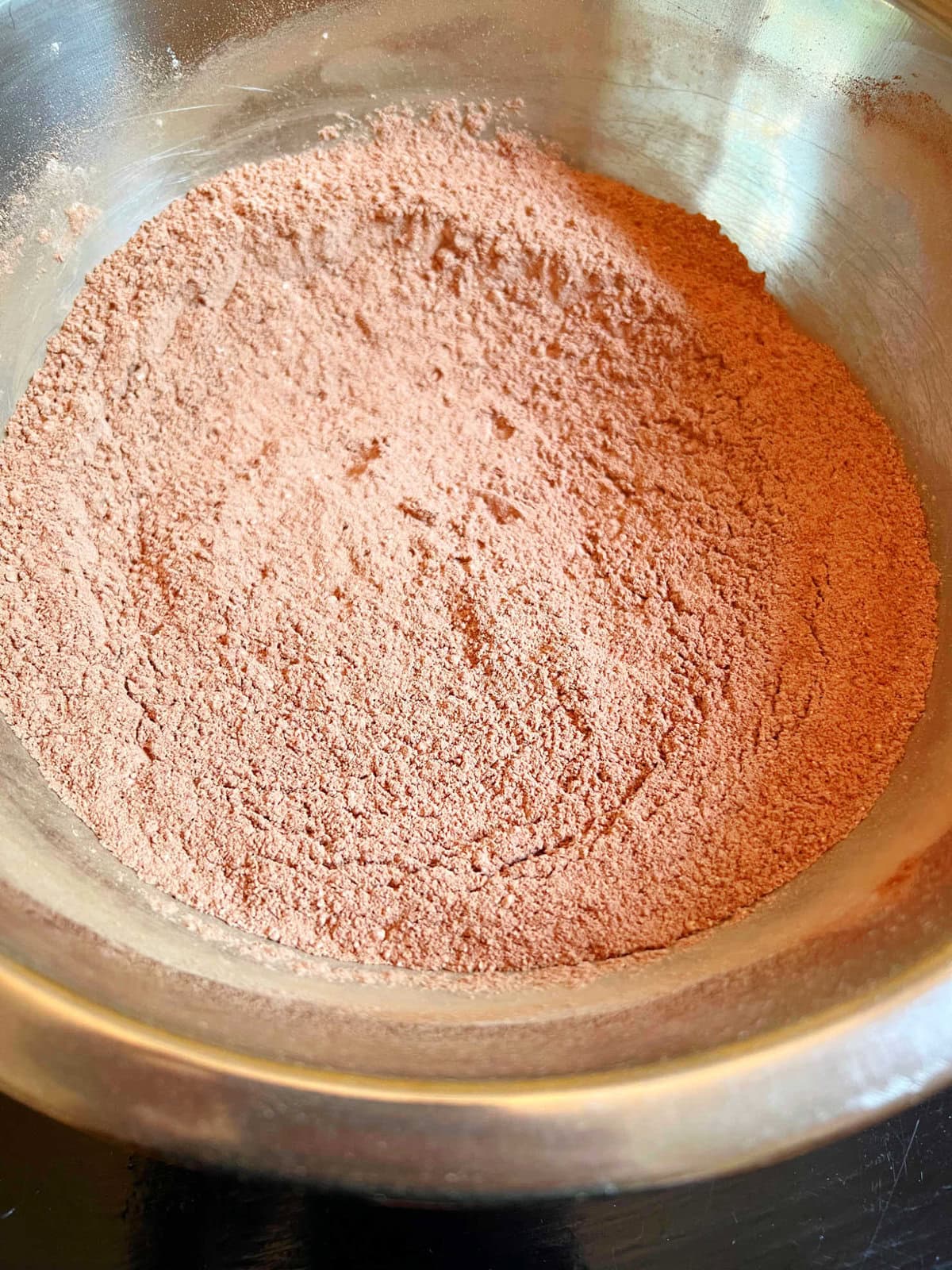 Dry ingredients in a bowl for the mint chocolate cupcakes.