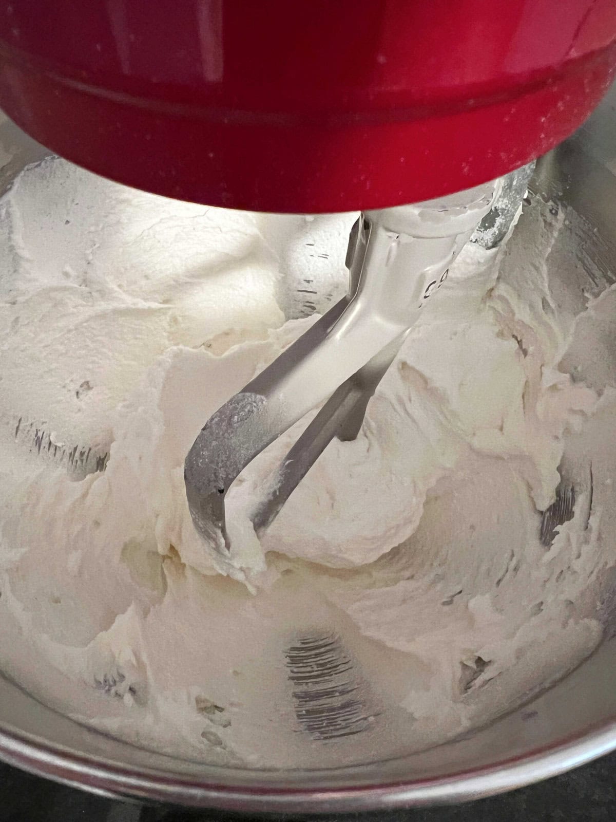 Mixing butter and sugar in mixing bowl.