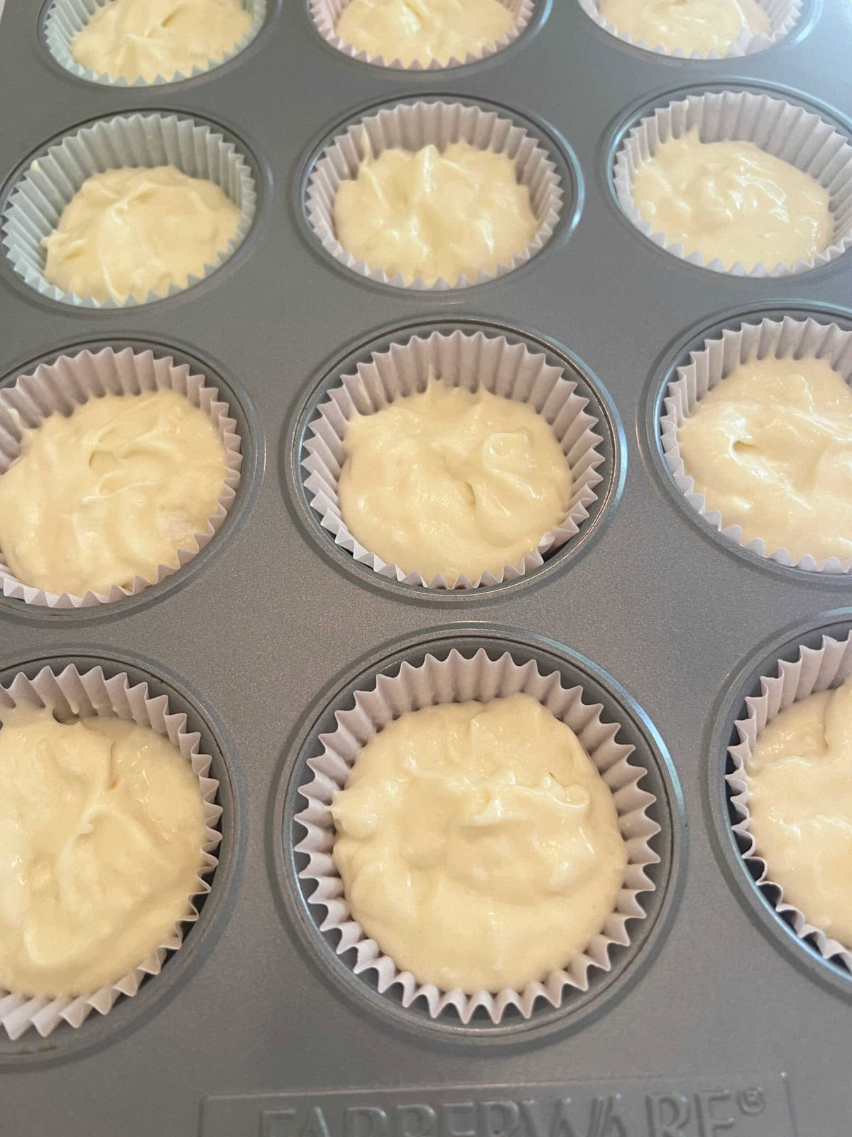 Coconut Cupcake Batter in the cupcake pan.