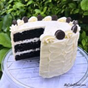 Black Velvet Cake, sliced, on a cake pedestal.
