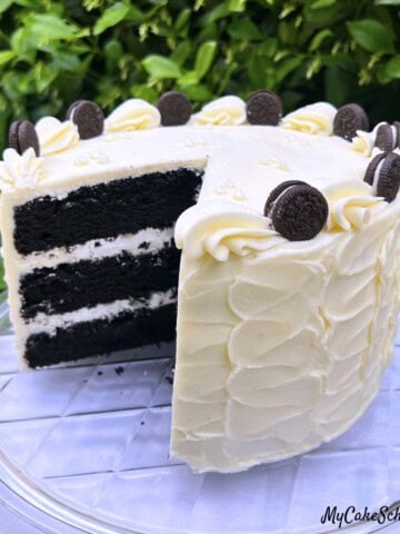 Black Velvet Cake, sliced, on a cake pedestal.