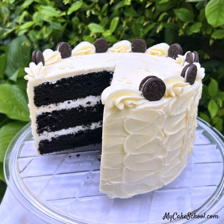 Black Velvet Cake, sliced, on a cake pedestal.