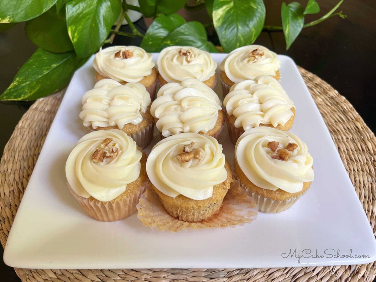 Platter of Hummingbird Cupcakes, frosted with cream cheese frosting.