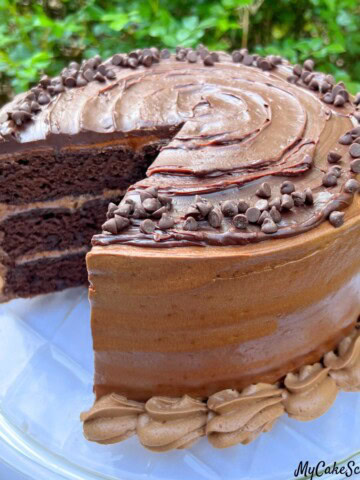 Triple Chocolate Cake, sliced, on a cake plate.