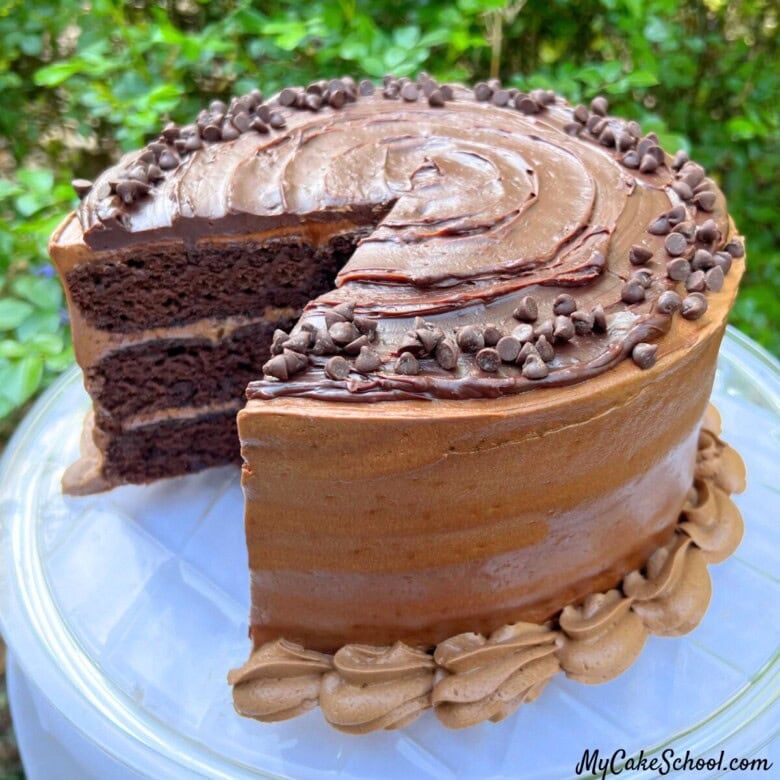 Triple Chocolate Cake, sliced, on a cake plate.