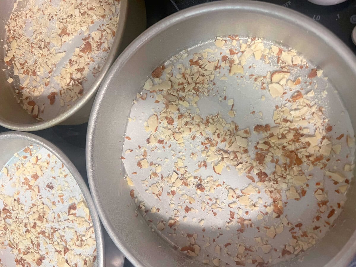Almonds sprinkled into pans before batter added.