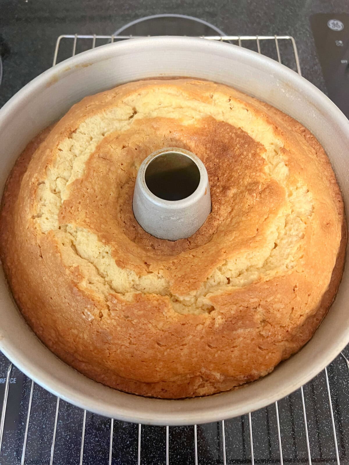 Butterscotch Pound Cake in pan, cooling on a wire rack.