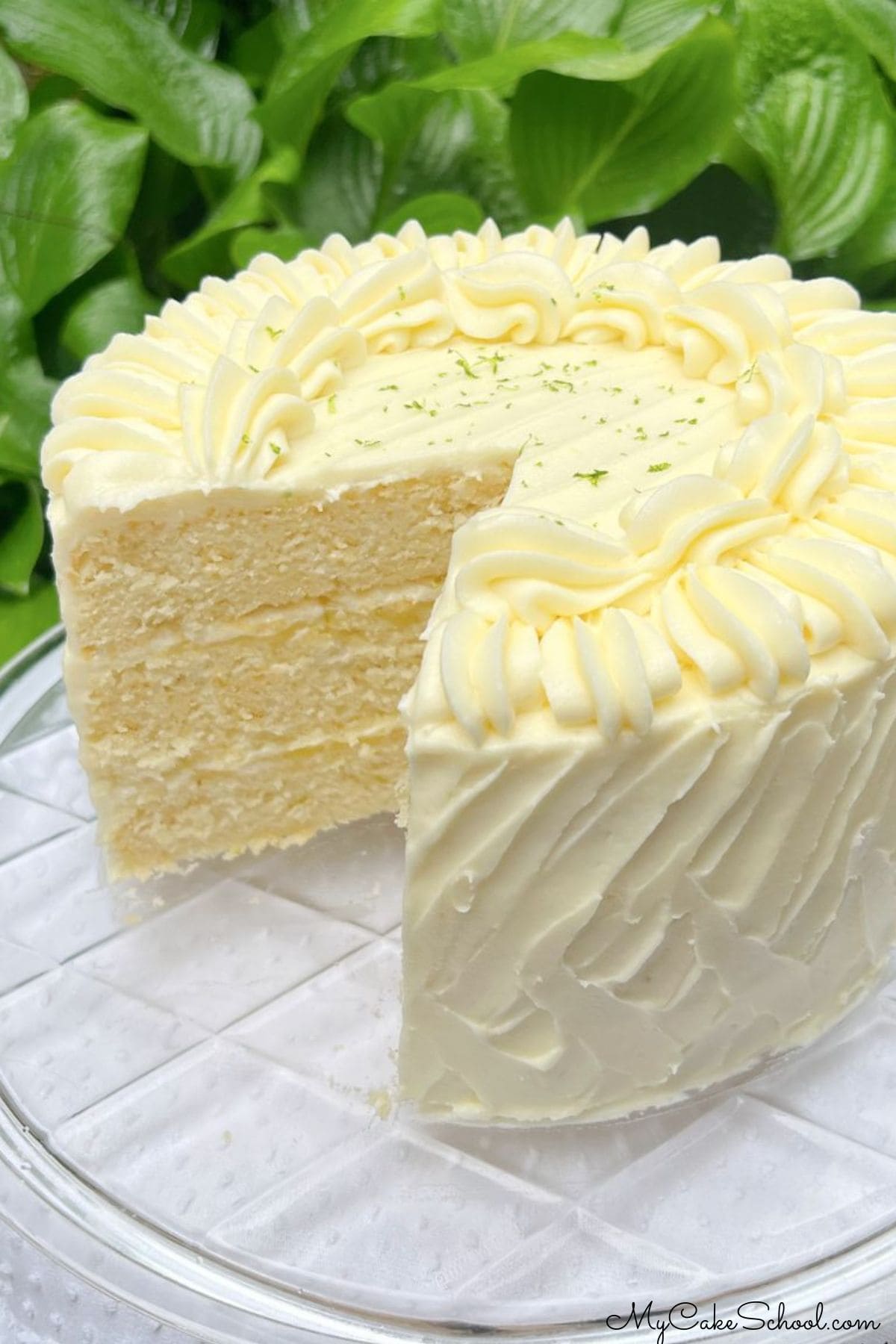 Lime Velvet Cake, sliced, on a cake plate.