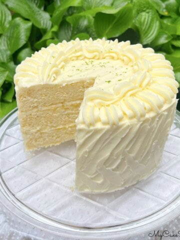 Lime Velvet Cake, sliced, on a cake plate.