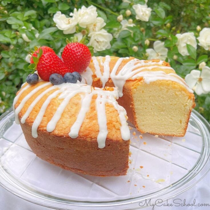 Sliced Ricotta Cake on a pedestal.