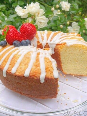 Ricotta cake, sliced, on a pedestal.