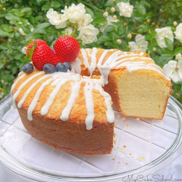 Ricotta cake, sliced, on a pedestal.