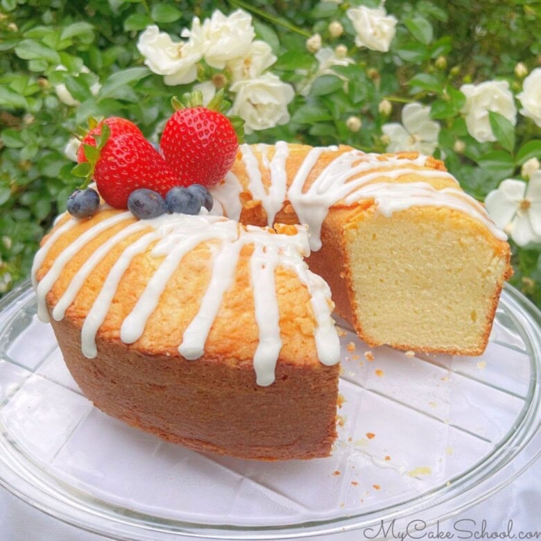 Ricotta cake, sliced, on a pedestal.