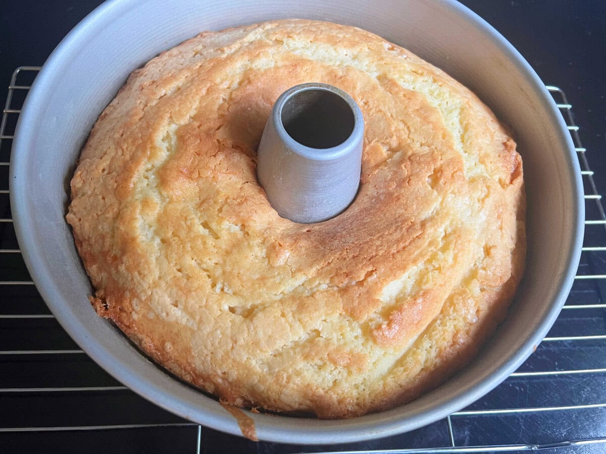 Ricotta Cake in a bundt cake pan, cooling on rack.