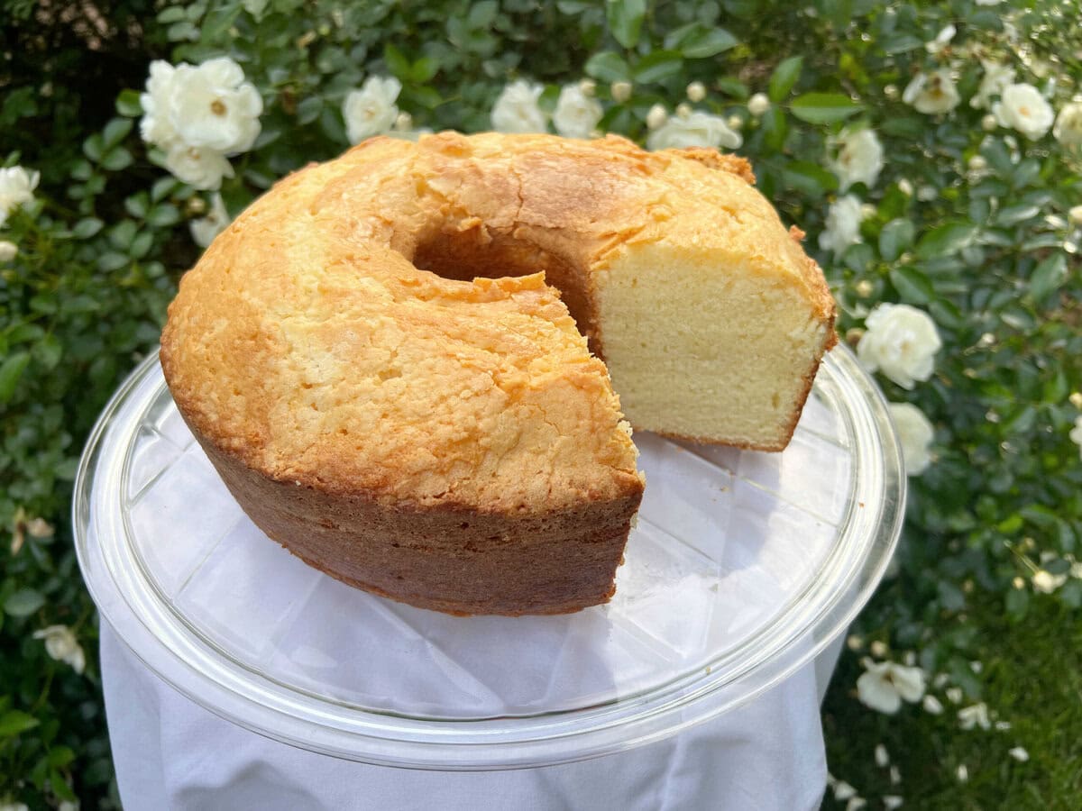 Ricotta Cake before glazing, on a pedestal.