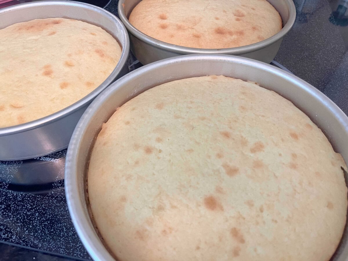 Baked layers in their pans for easy almond cake.
