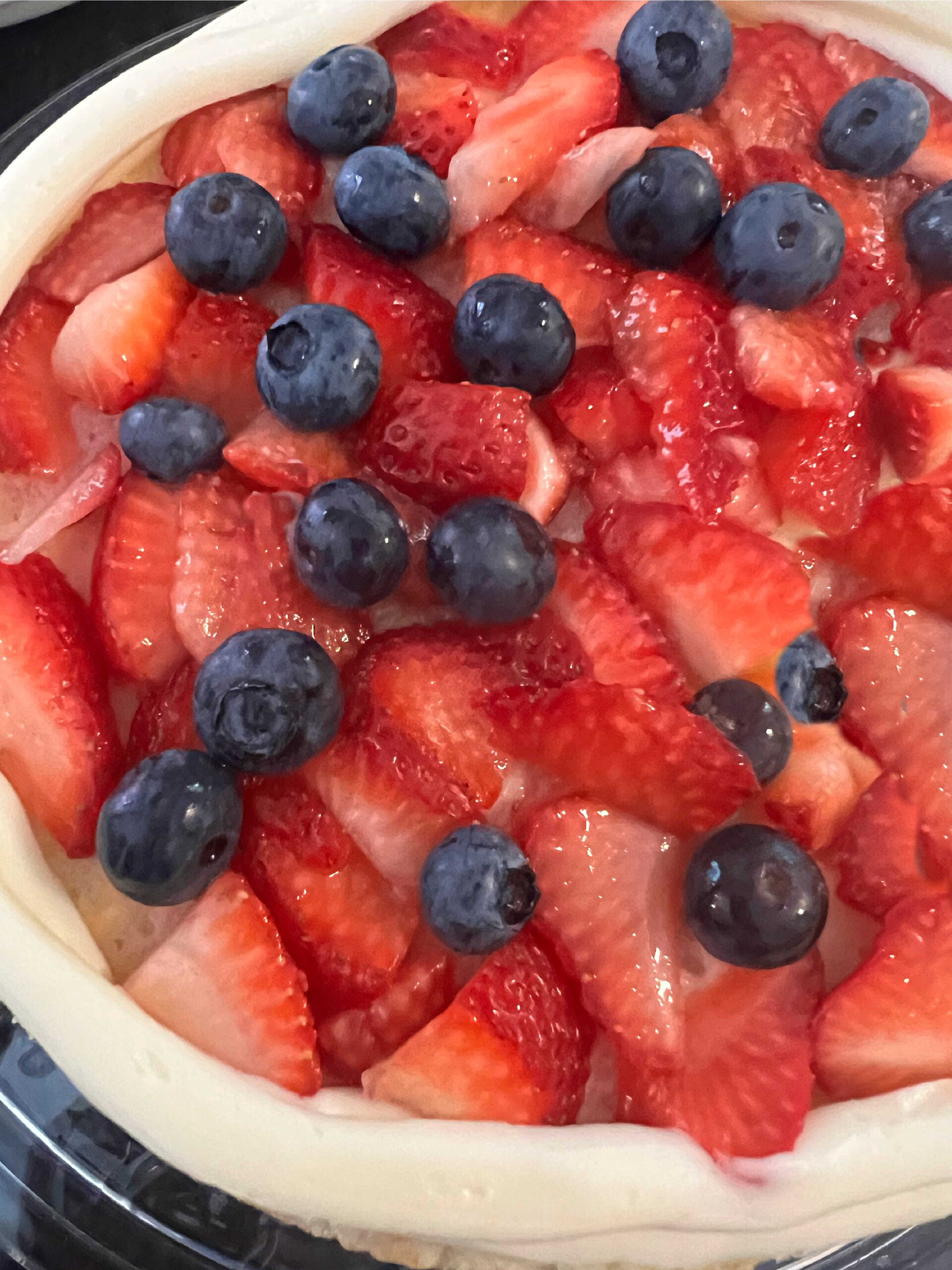 Berries on a vanilla mascarpone cake layer.