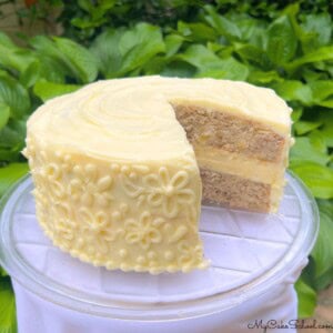 Hummingbird Cheesecake Cake, sliced, on a cake plate.
