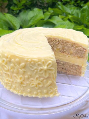 Hummingbird Cheesecake Cake, sliced, on a cake plate.