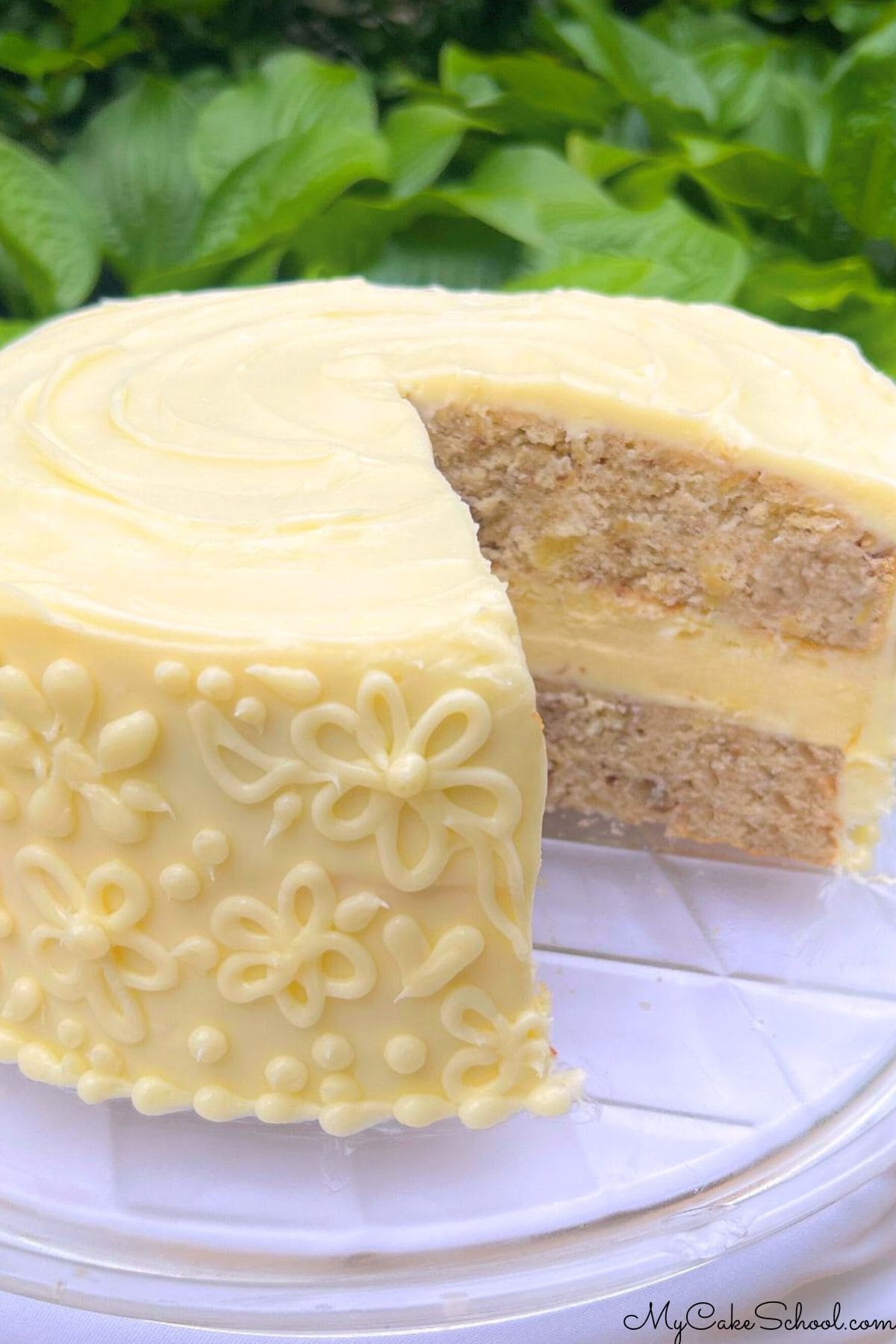 Hummingbird Cheesecake Cake, sliced, on a cake plate.