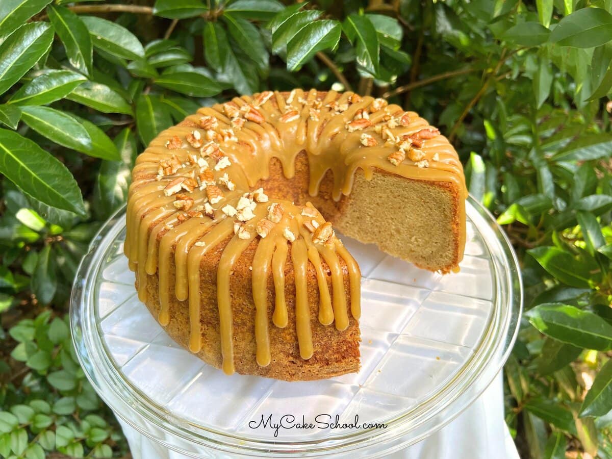 Caramel Glazed Brown Sugar Pound Cake on a cake pedestal.