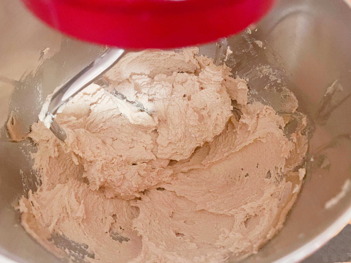 Creaming the butter and sugar in a mixing bowl.
